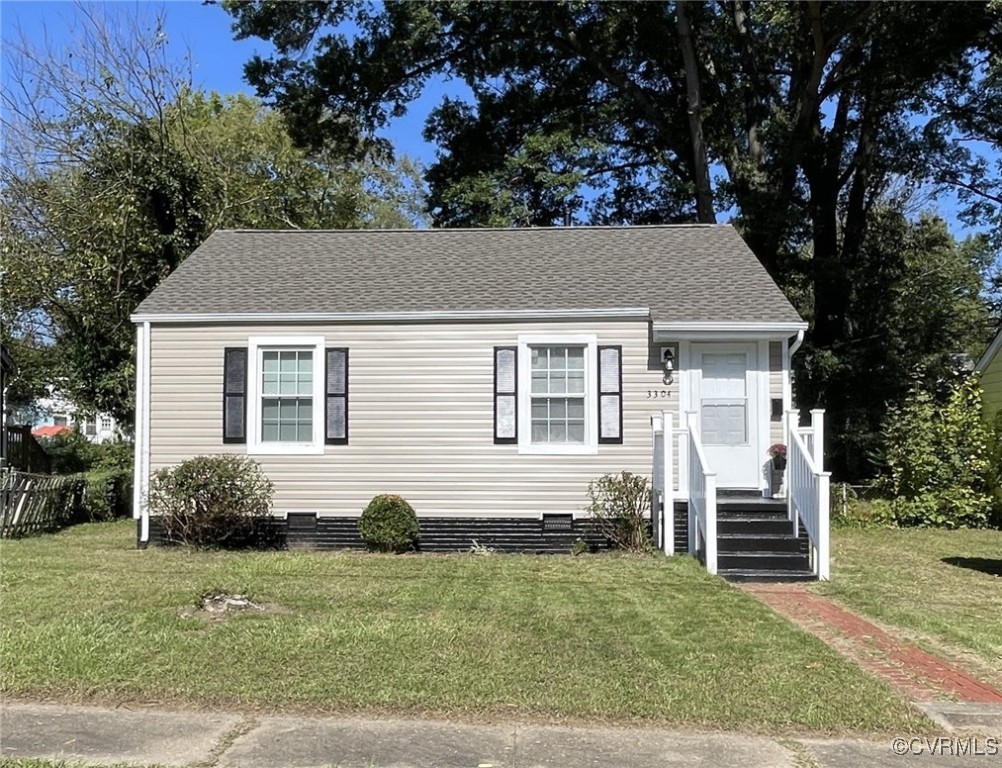 a house that has a tree in front of the house