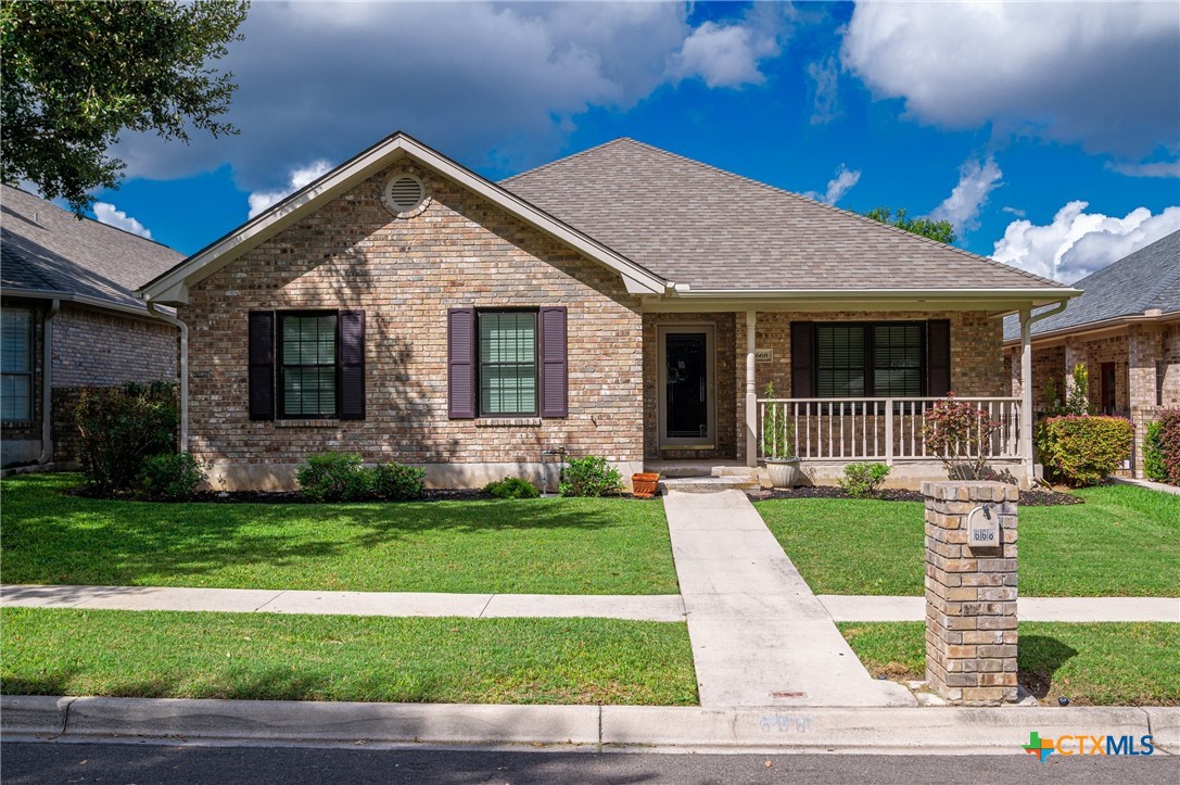 a view of a house with a yard