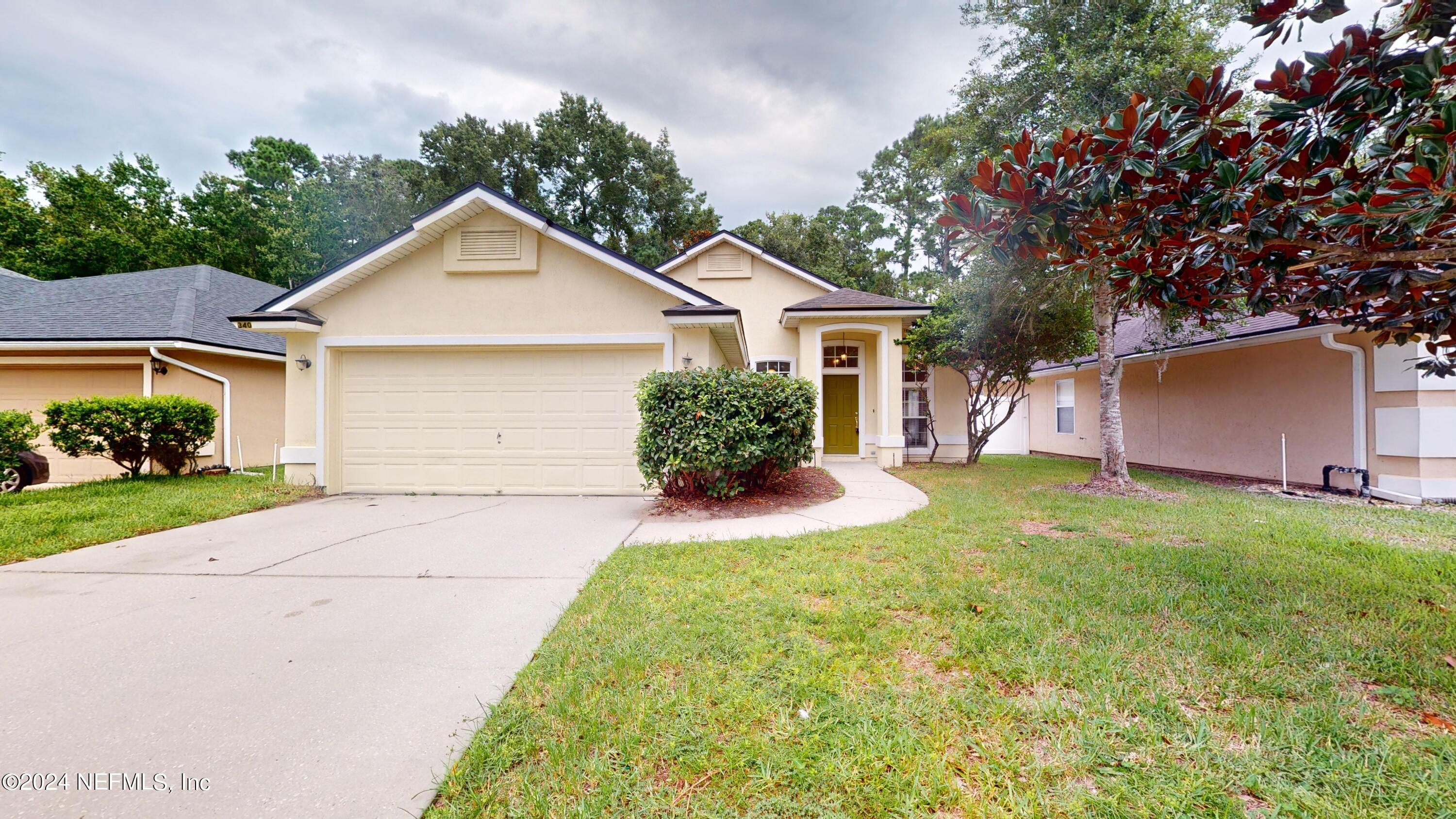 front view of a house with a yard