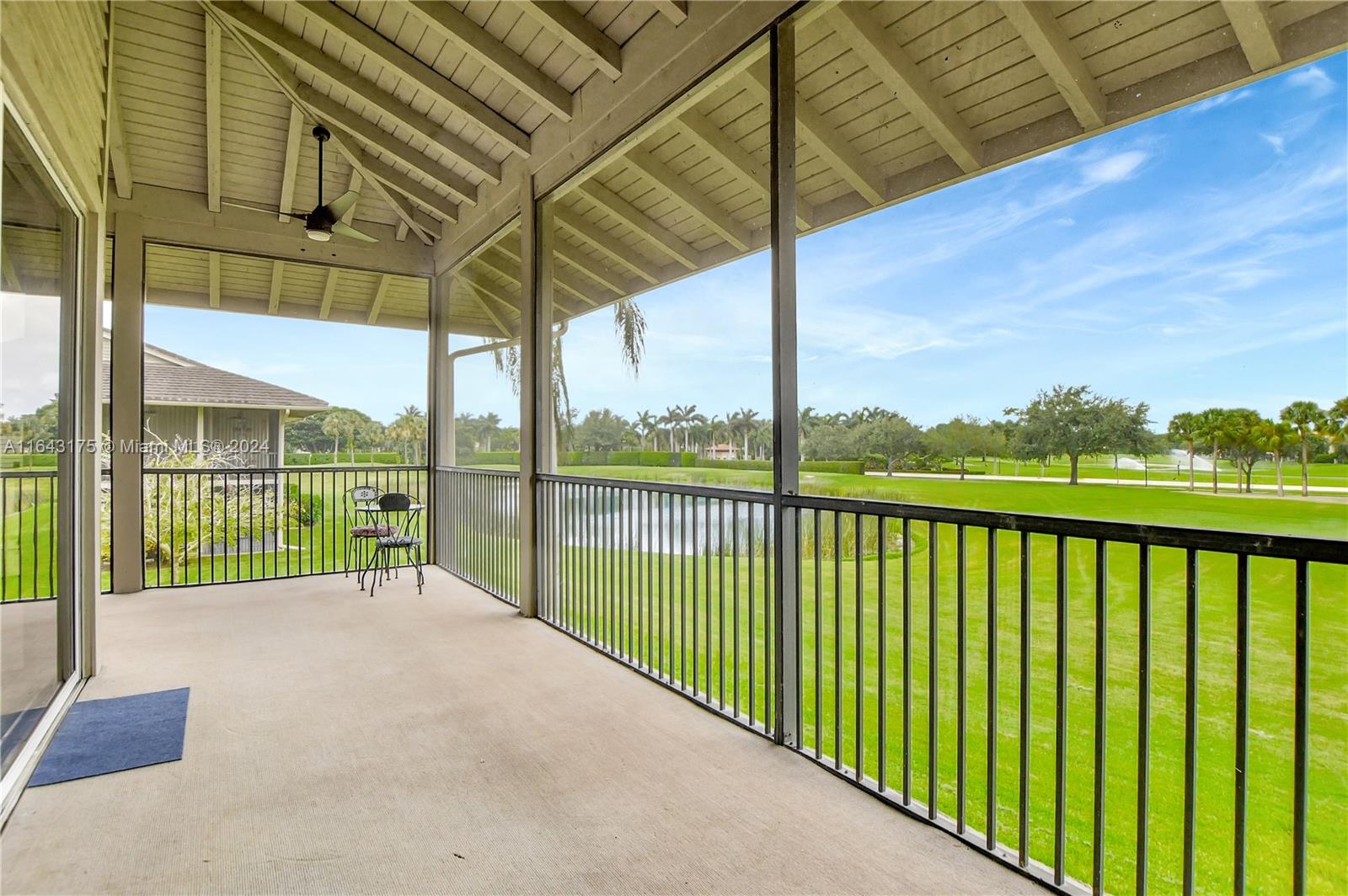 a view of balcony with a floor to ceiling window and wooden fence