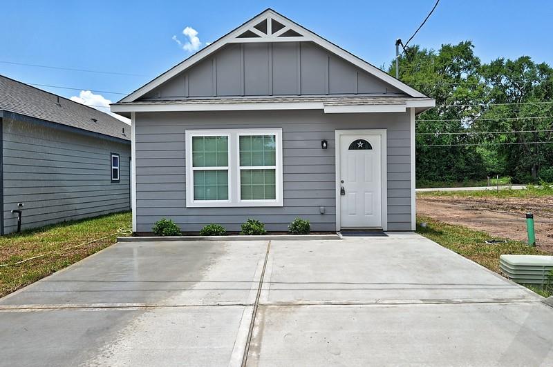 a front view of a house with garage