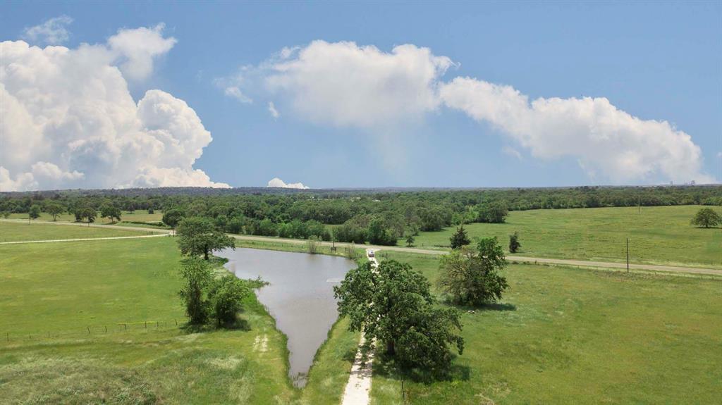 a view of lake with green space