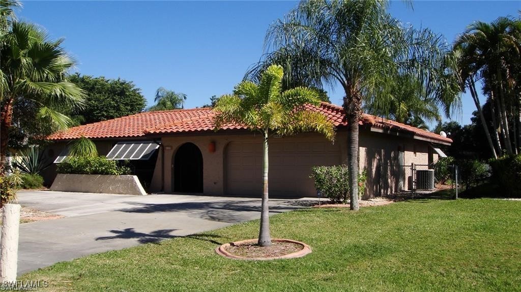 a house with a tree in front of it