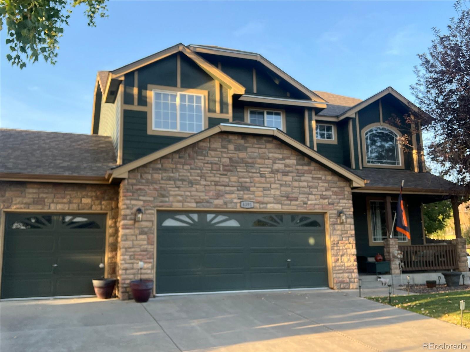 a front view of a house with garage