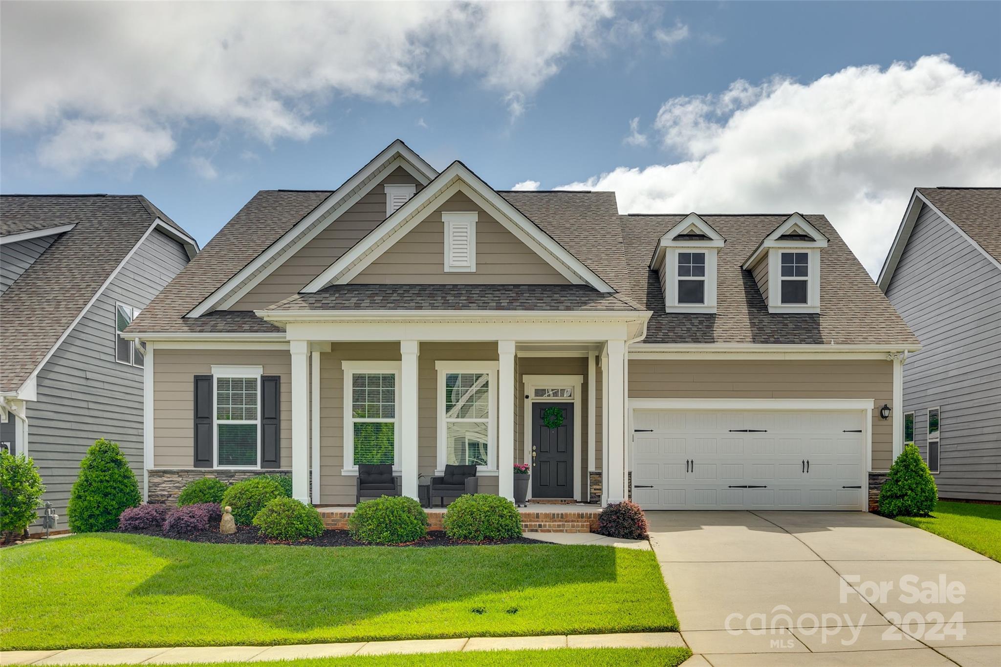 front view of a house with a yard