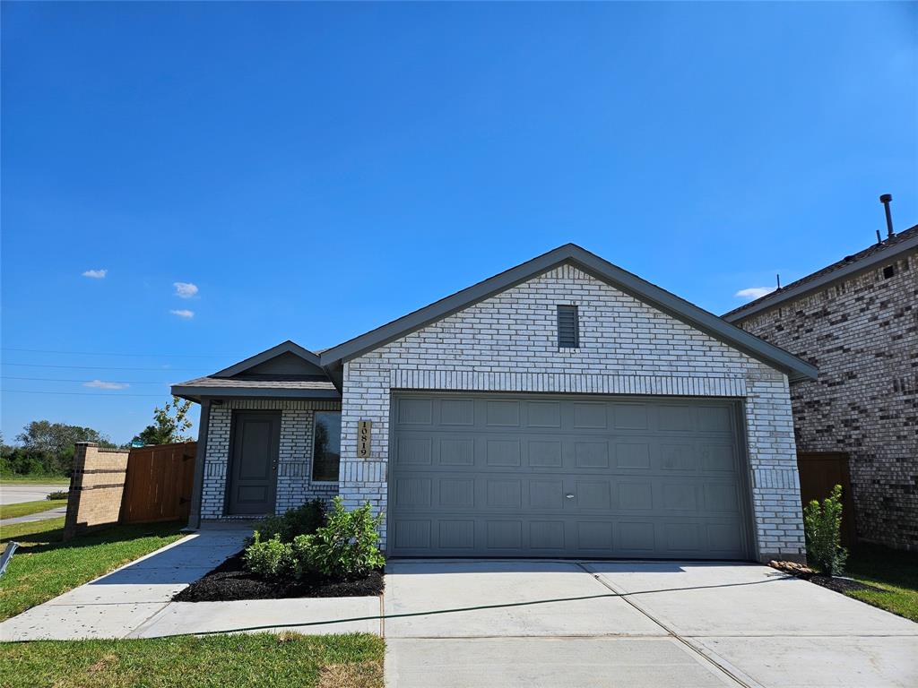 a front view of a house with garage