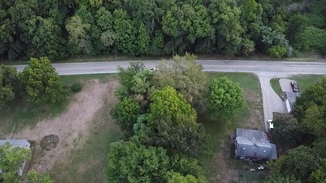 an aerial view of backyard with green space