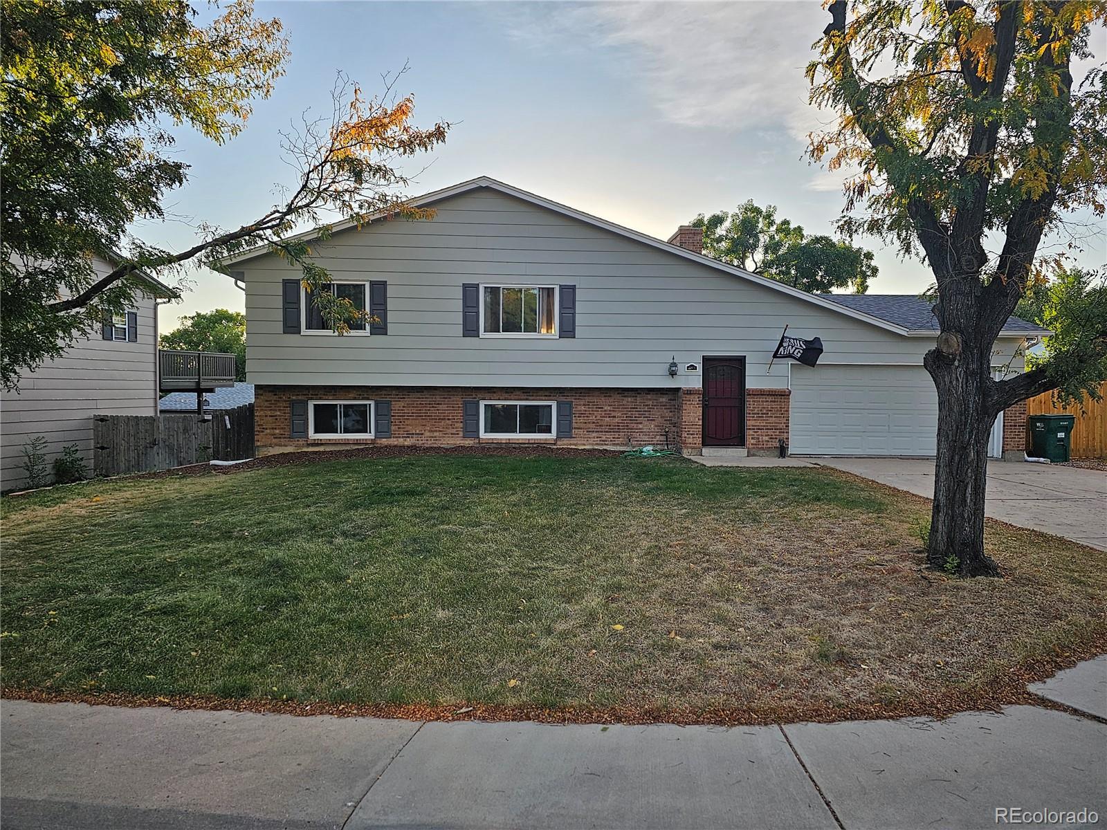 front view of a house with a yard