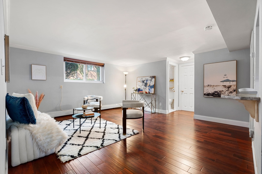 a view of a livingroom with furniture and wooden floor