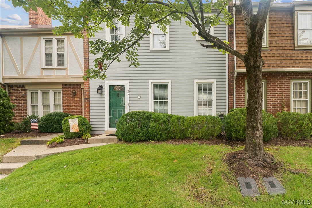 a front view of a house with a yard