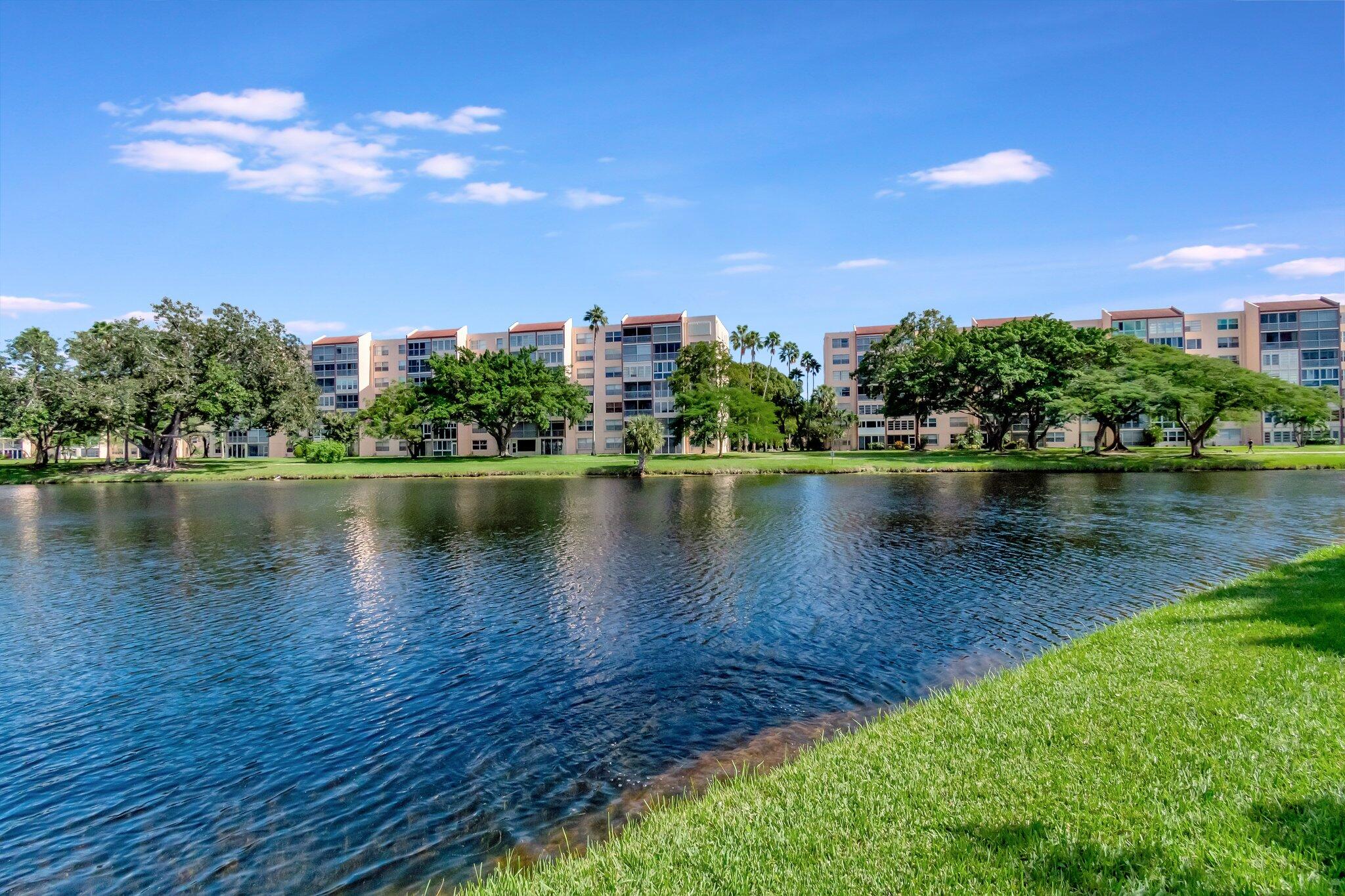 a view of a lake with houses in the back