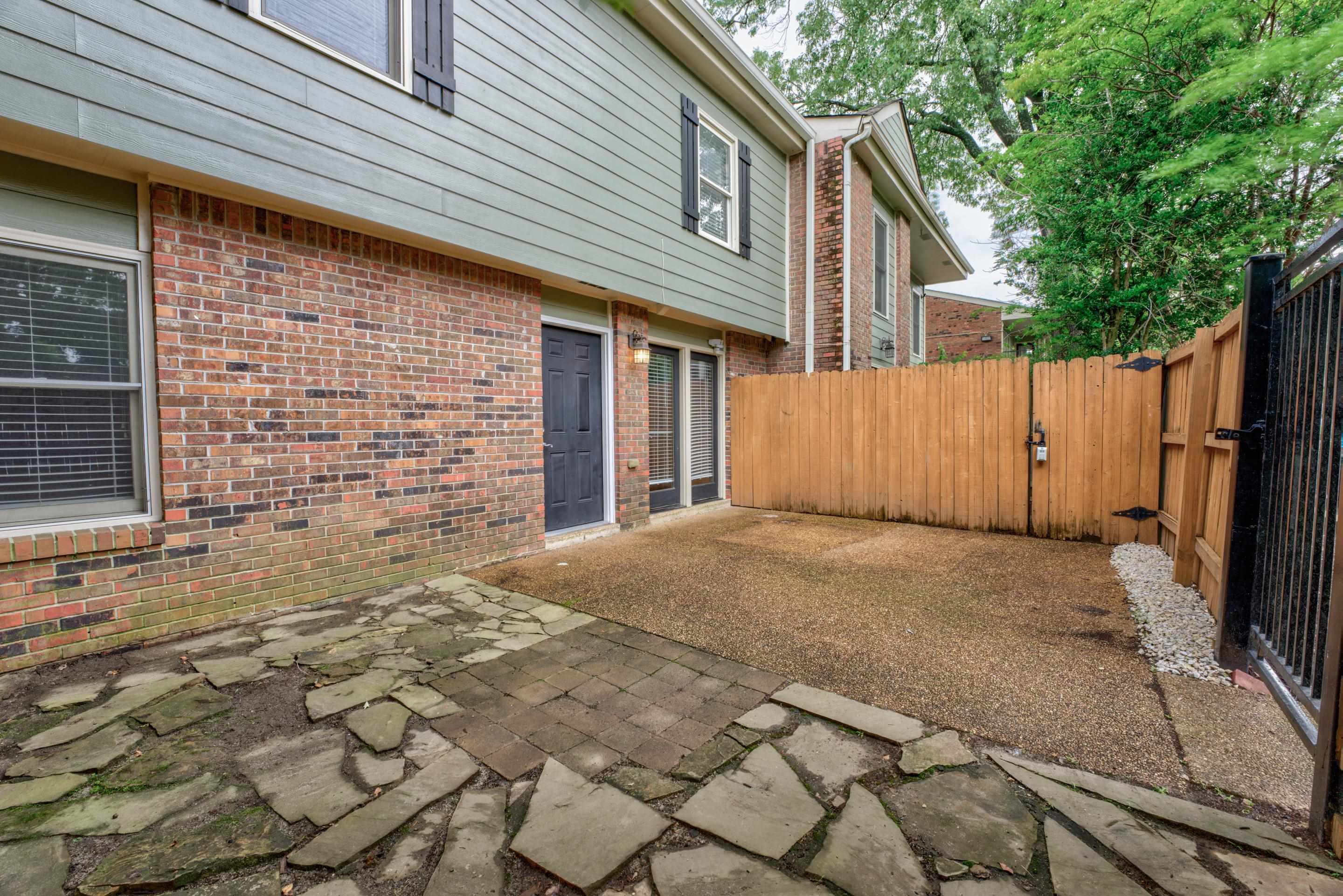 a view of backyard of a house