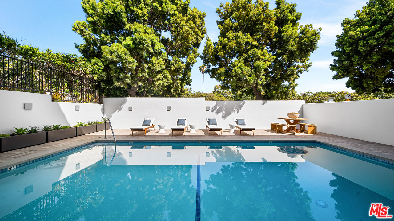 a view of swimming pool from a balcony