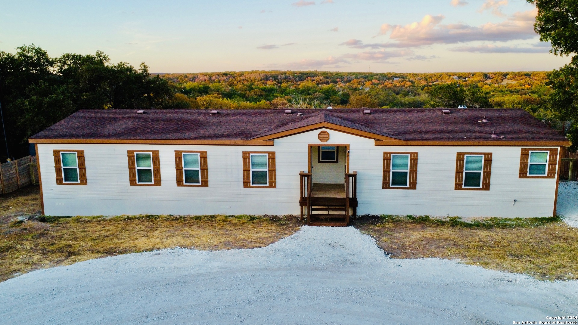 a house with trees in the background