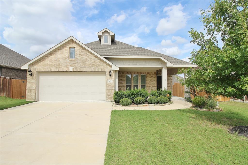 a front view of a house with yard