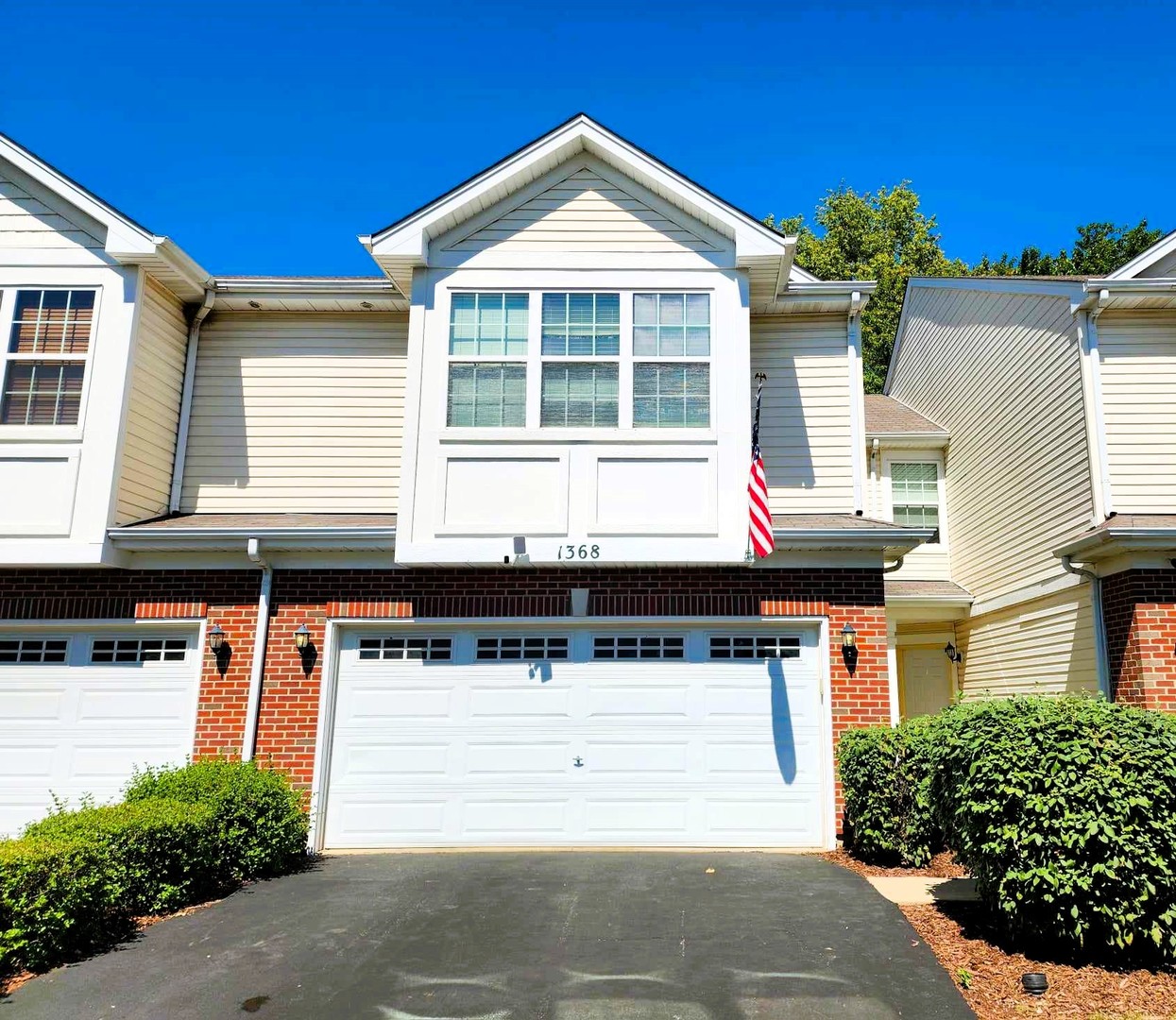 a front view of a house with a garage