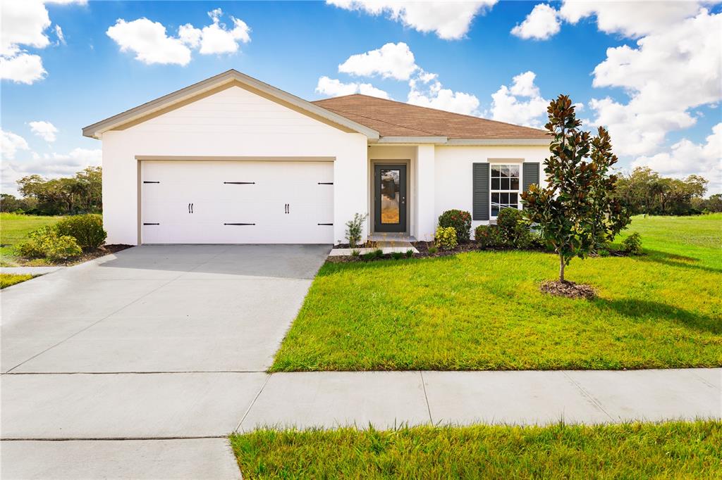 front view of a house with a yard