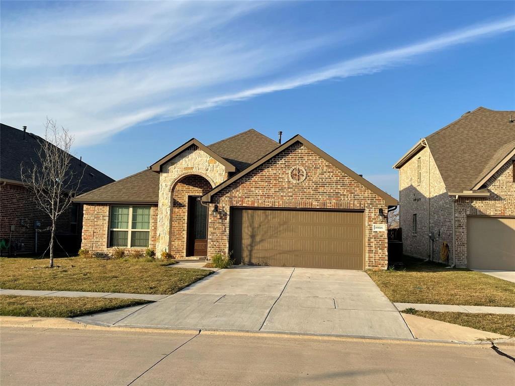 a front view of a house with yard