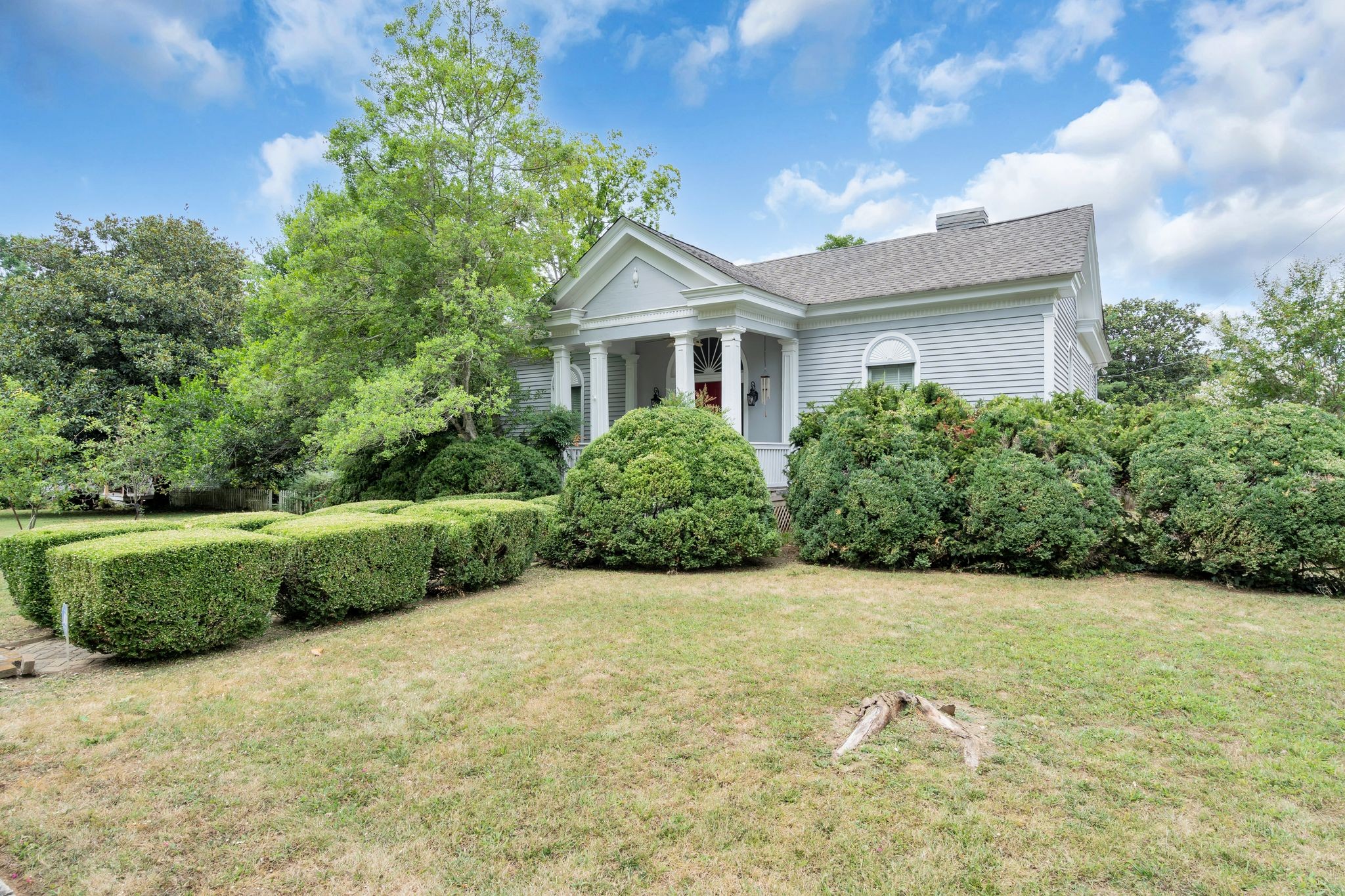 a front view of a house with a yard