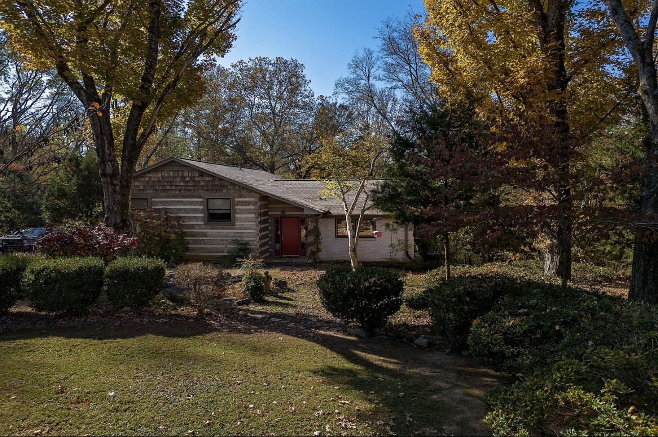 a backyard of a house with yard barbeque oven and outdoor seating