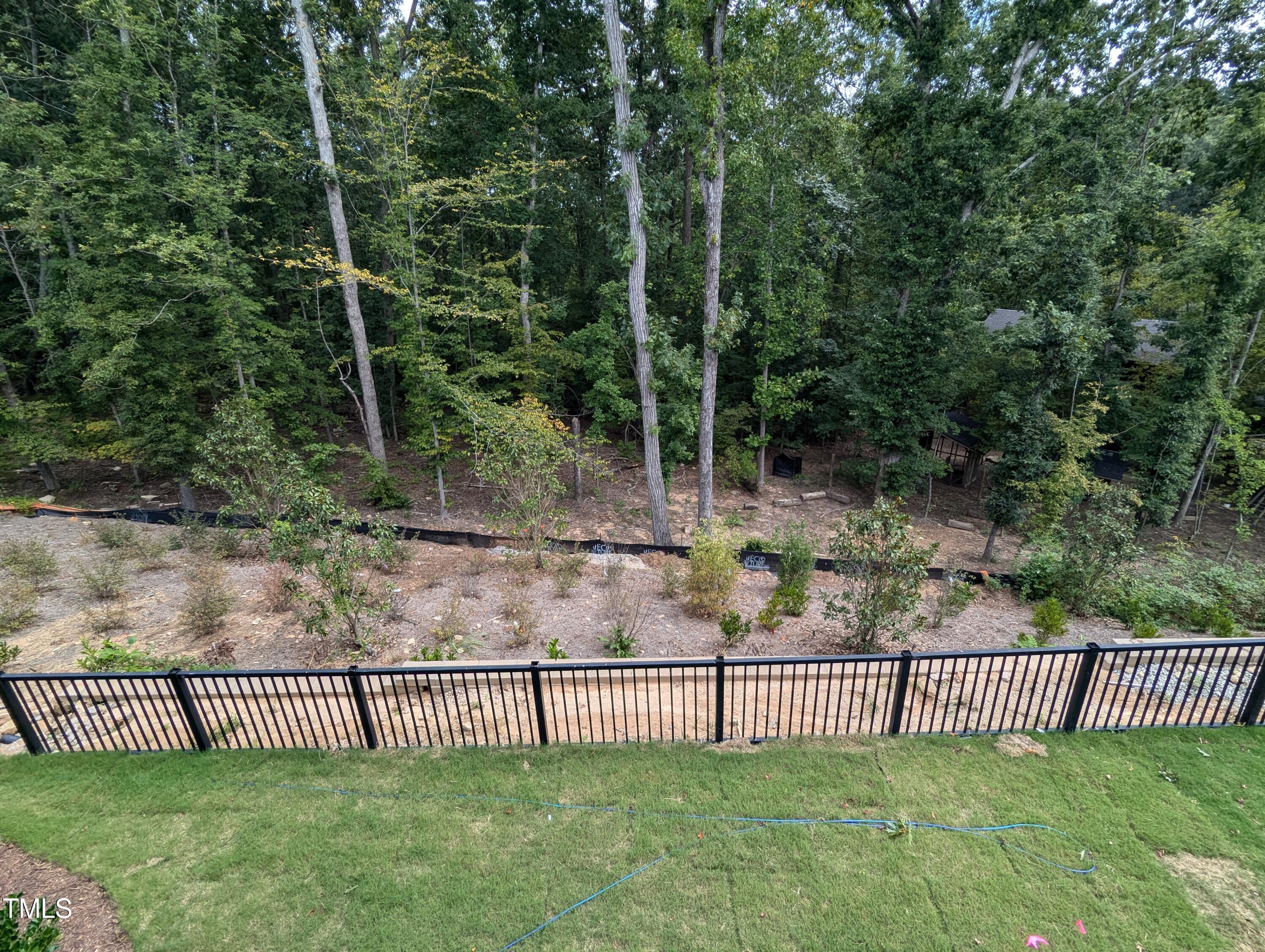 a view of a gate with a fence