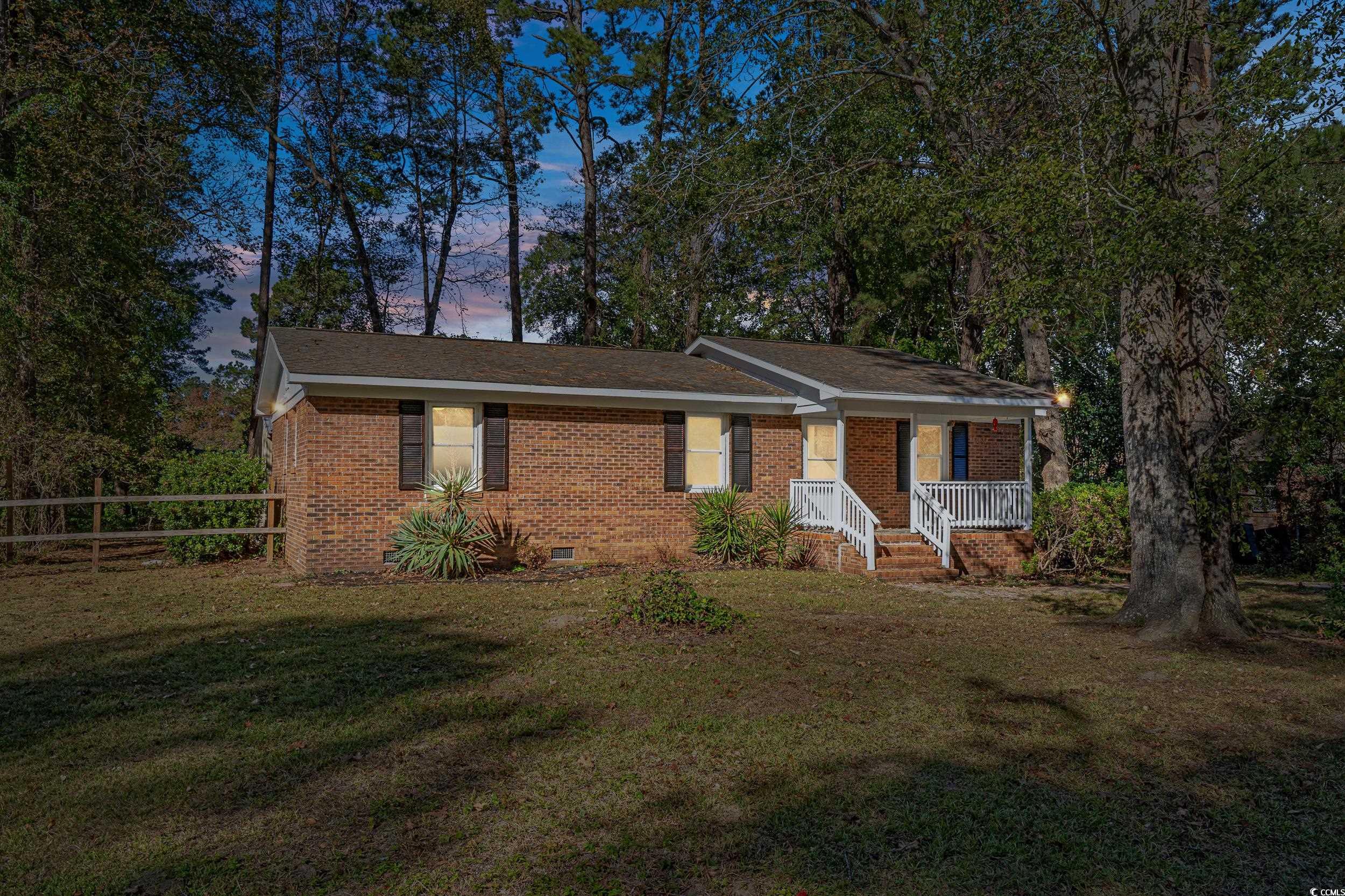 Ranch-style home with a lawn