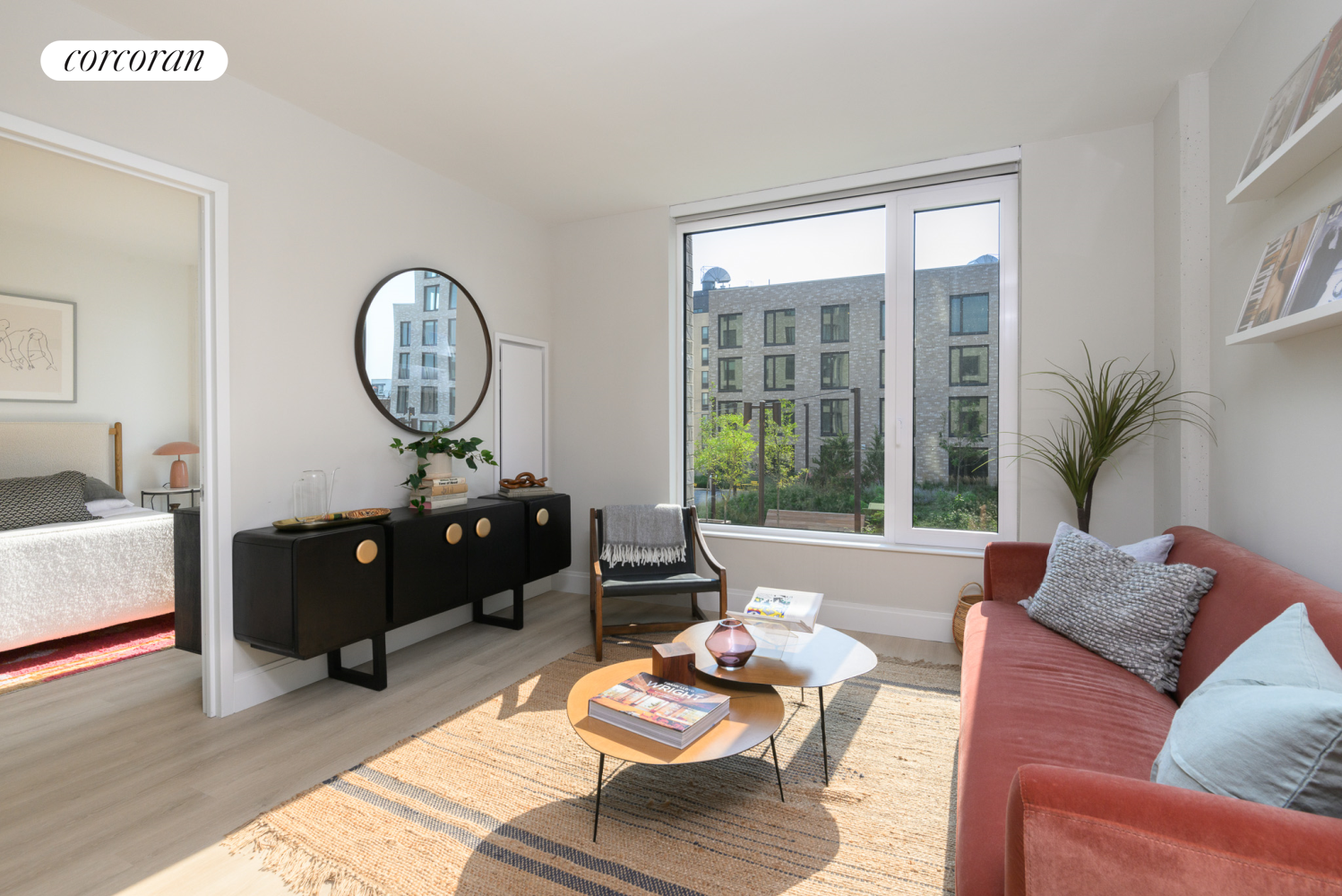 a living room with furniture and a large window