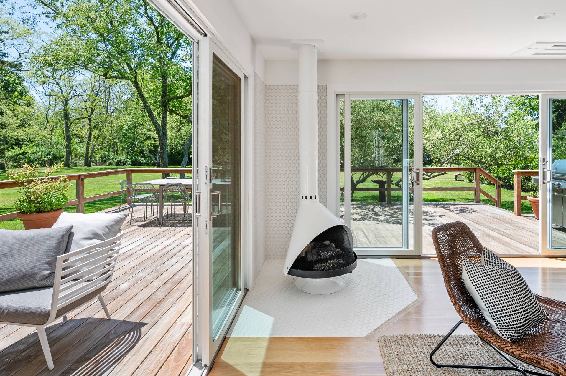 a view of a porch with furniture and garden