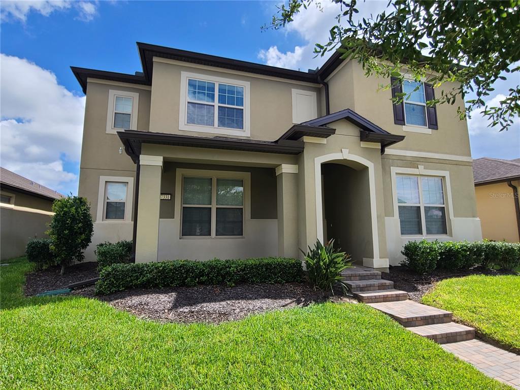 a front view of a house with a yard