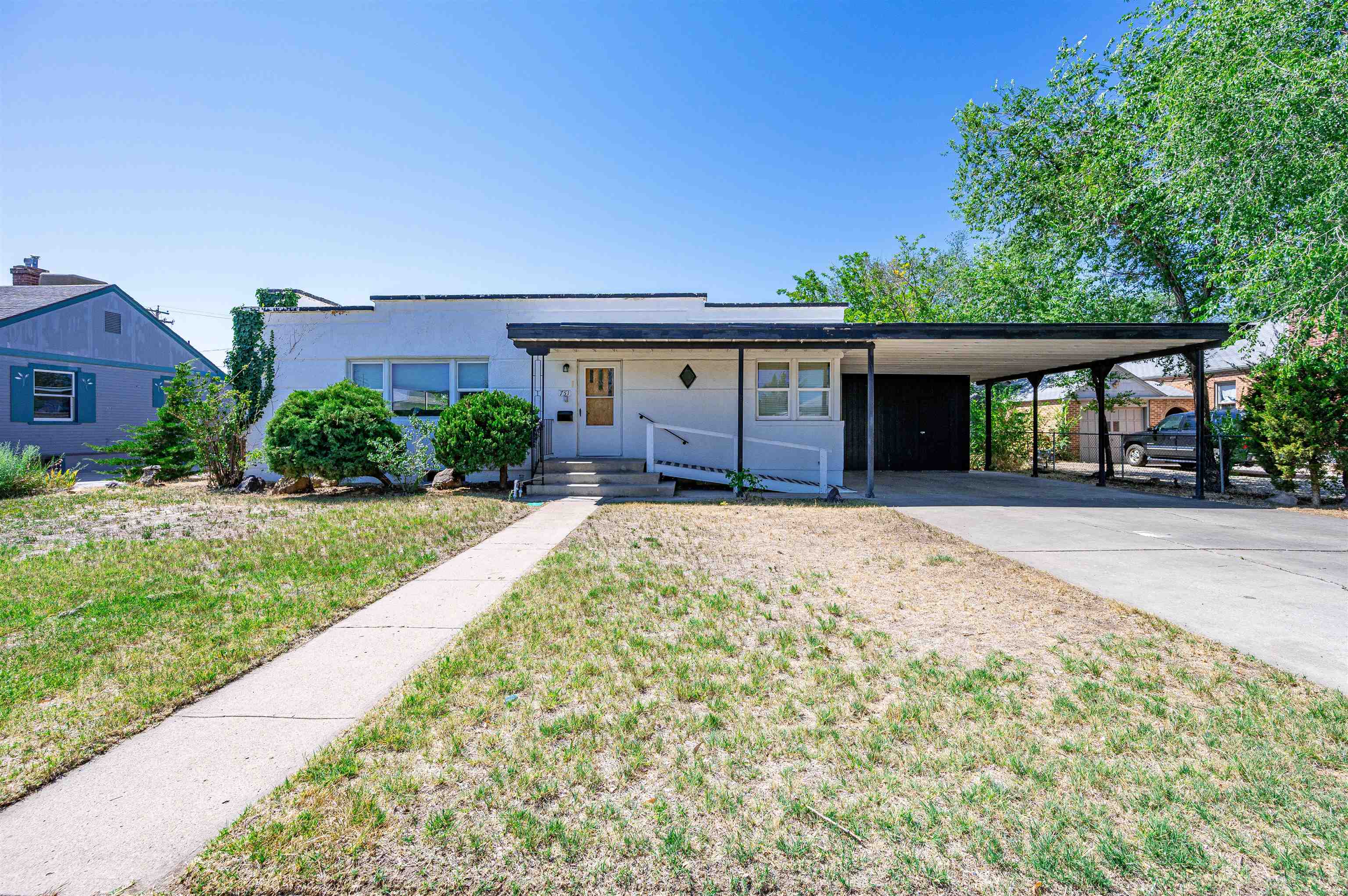 front view of a house with a yard