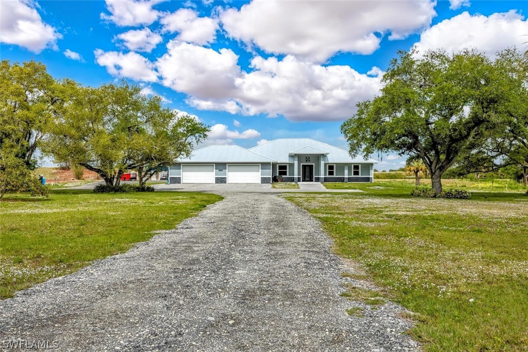 a view of house with outdoor space