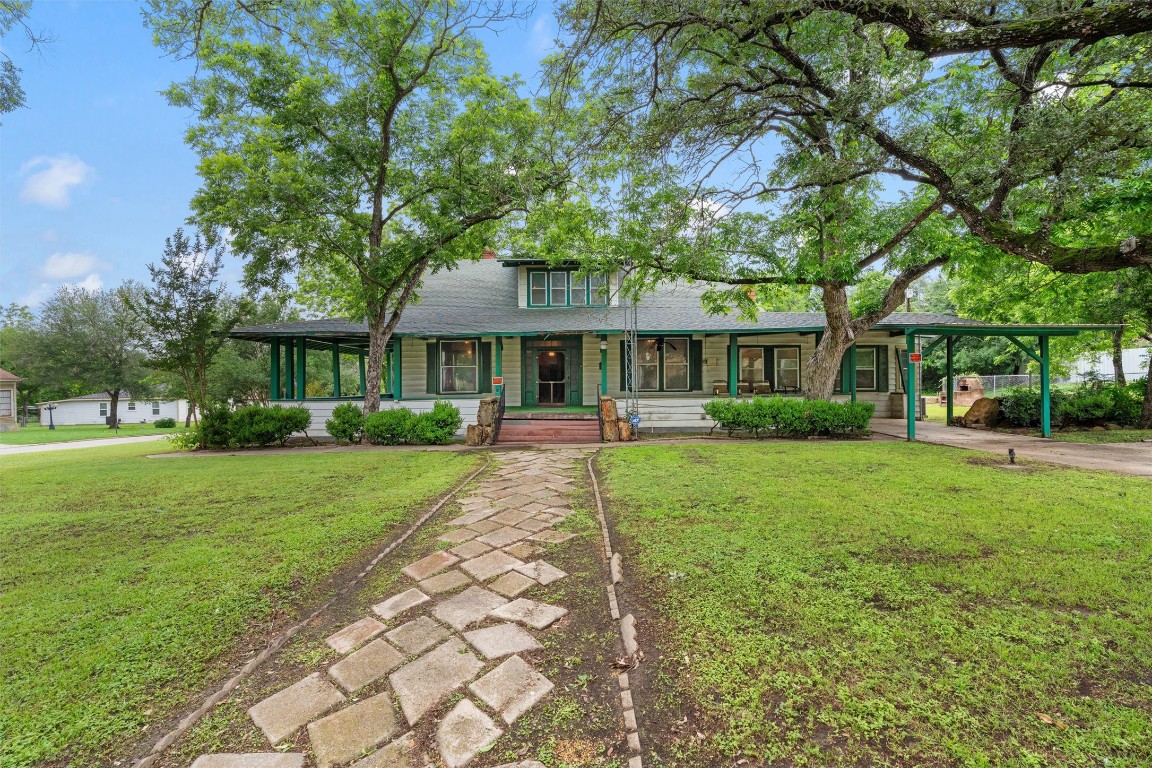 a front view of a house with a yard