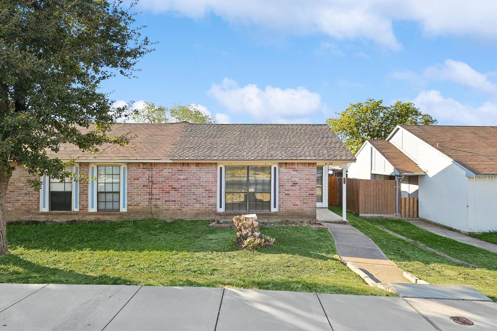 front view of a house with a yard