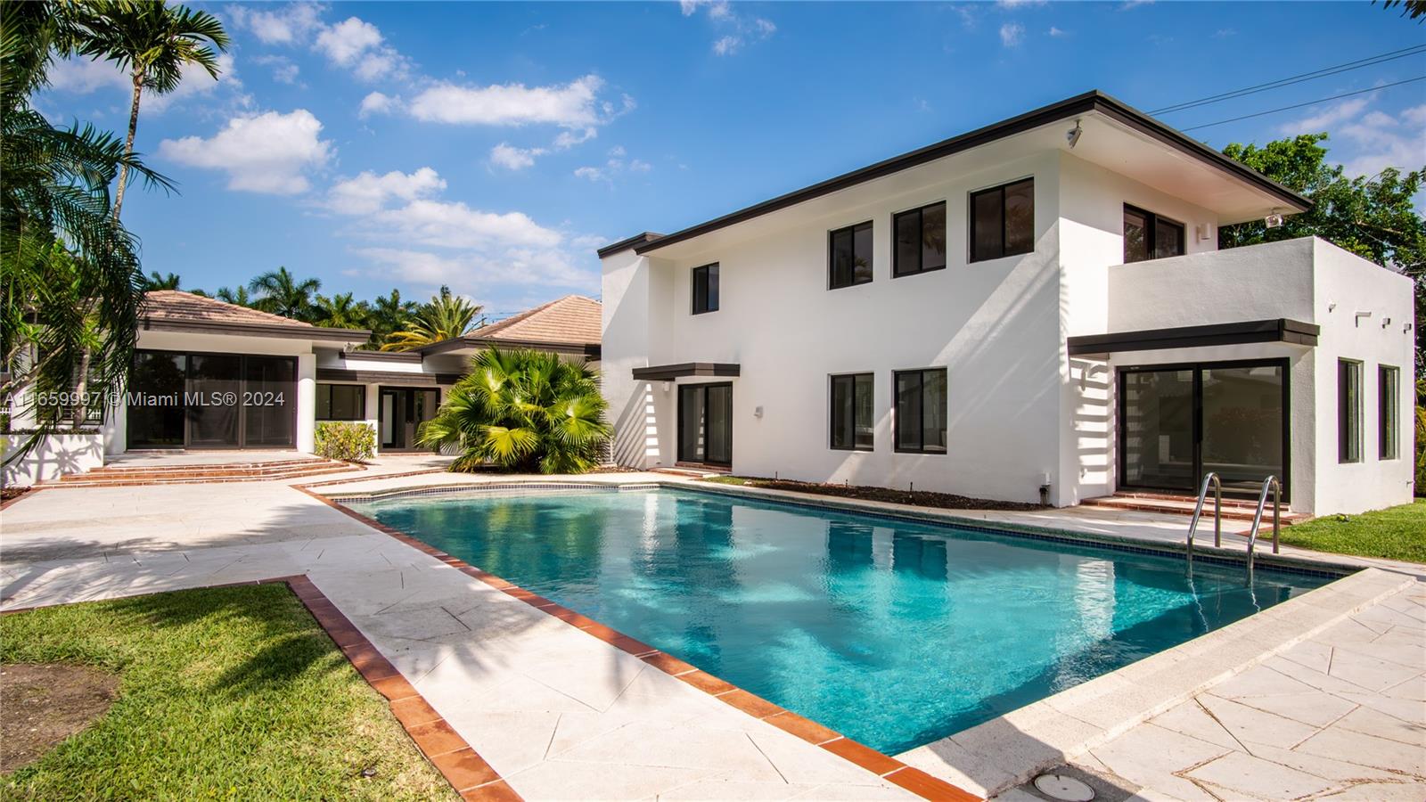 a view of a house with swimming pool