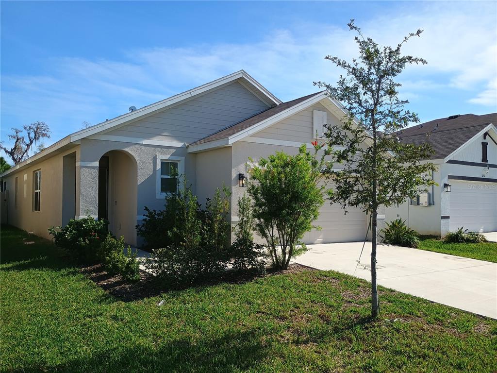 a front view of a house with garden