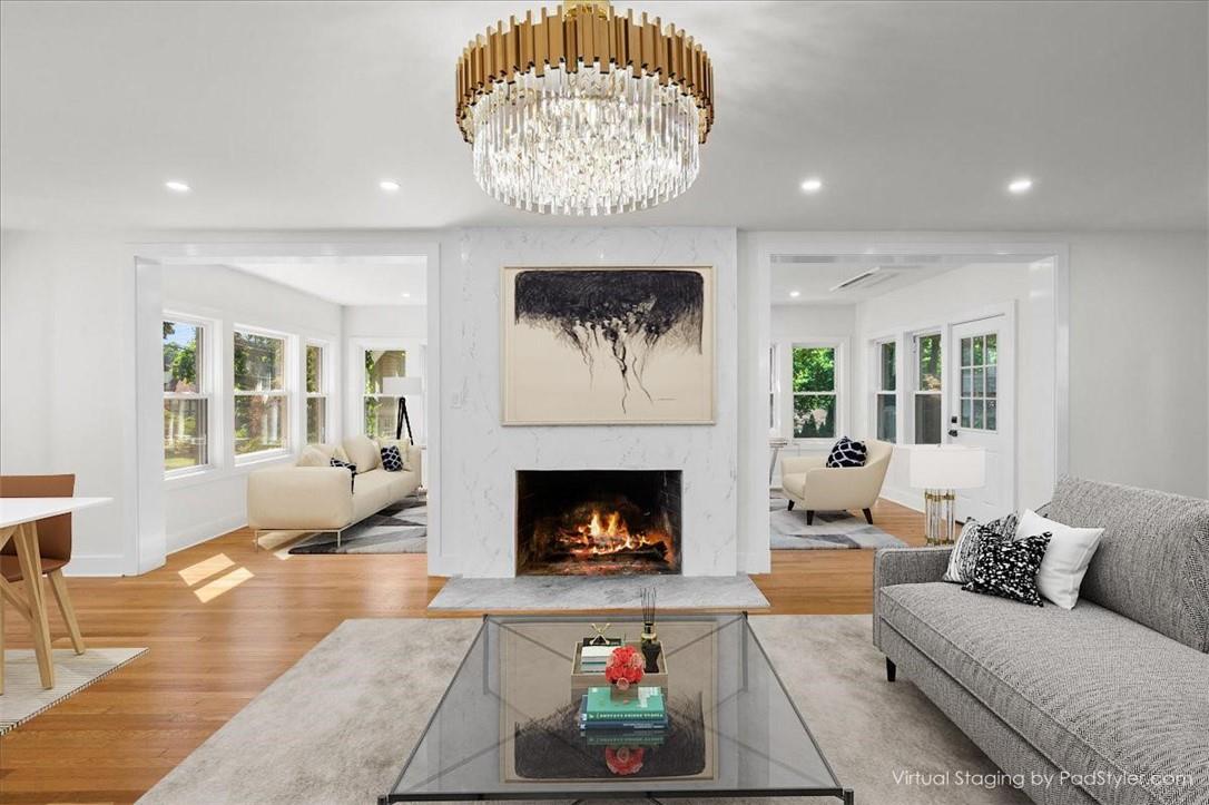 a living room with furniture and a fireplace