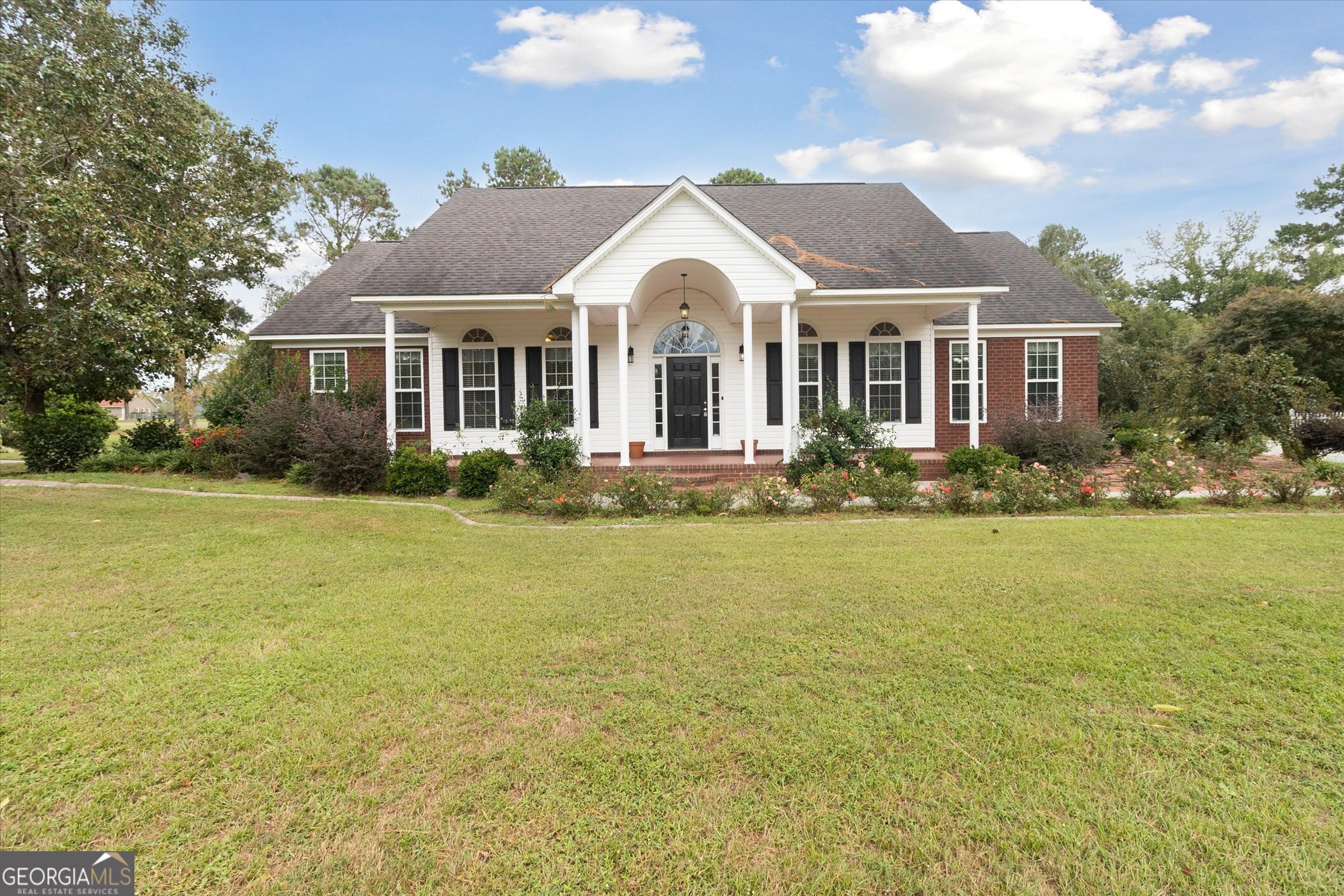 a front view of a house with swimming pool