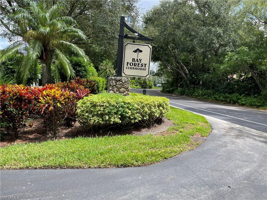 a view of a sign board with a yard