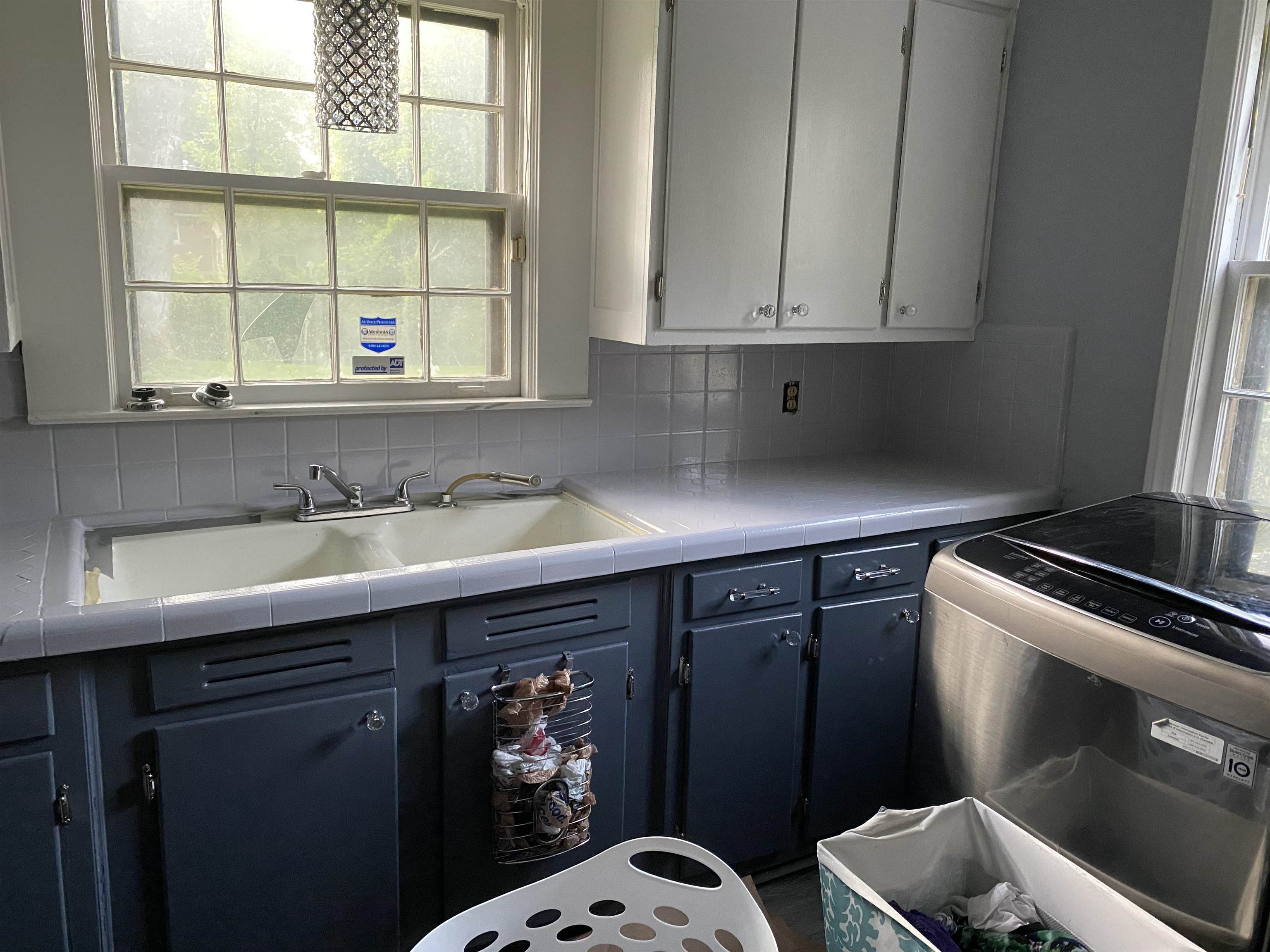 a kitchen with stainless steel appliances a sink dishwasher and cabinets