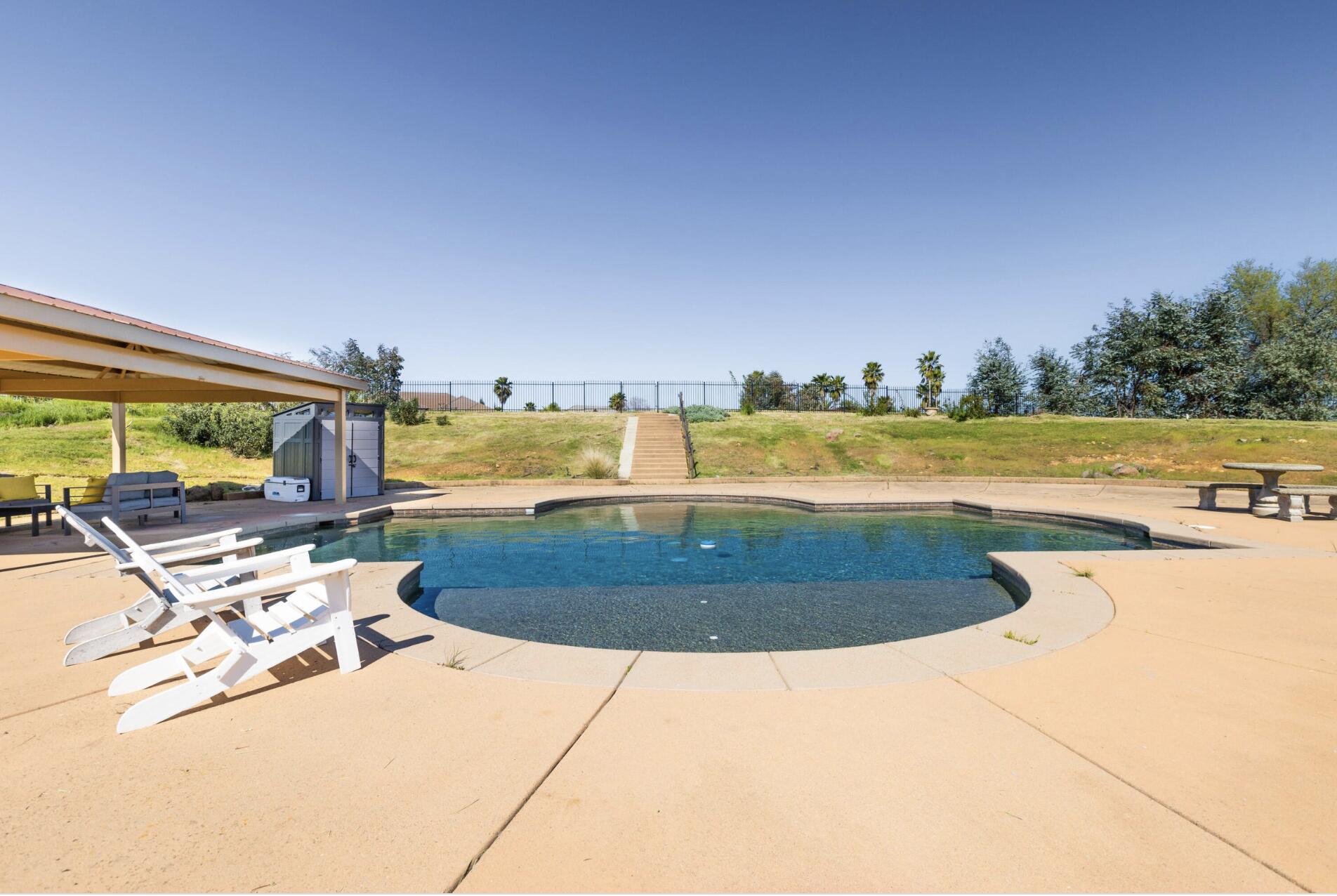 a view of a swimming pool with an ocean view