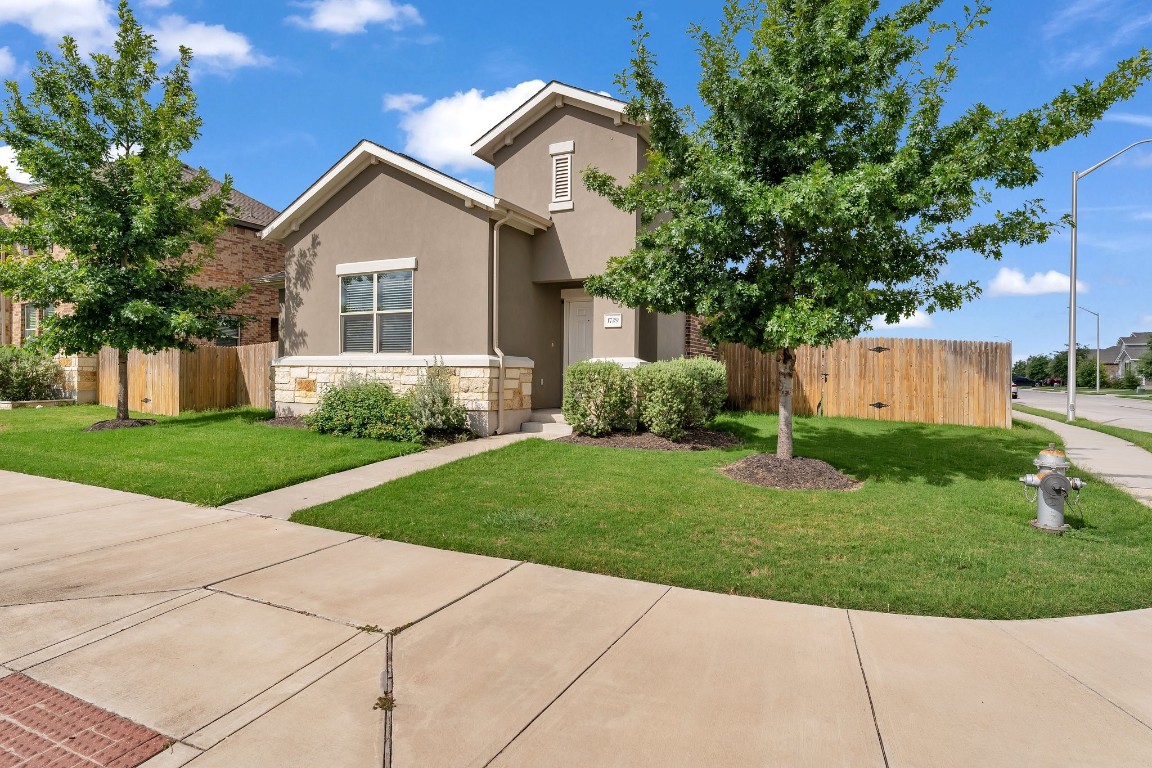 a view of a house with a yard