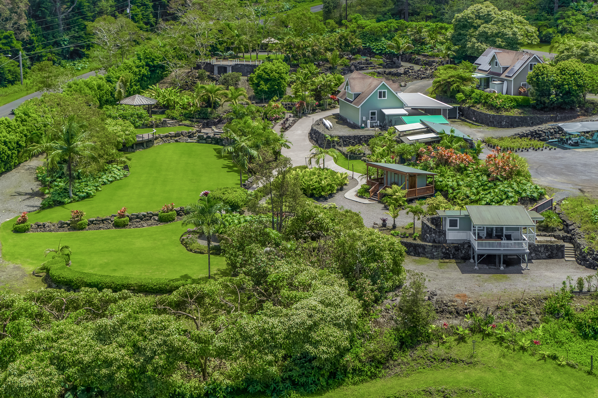 an aerial view of a house with a yard