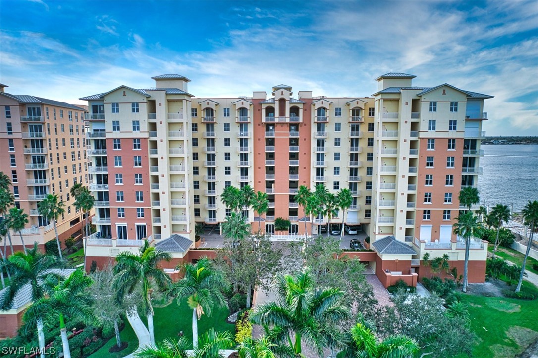 a front view of a building with a garden