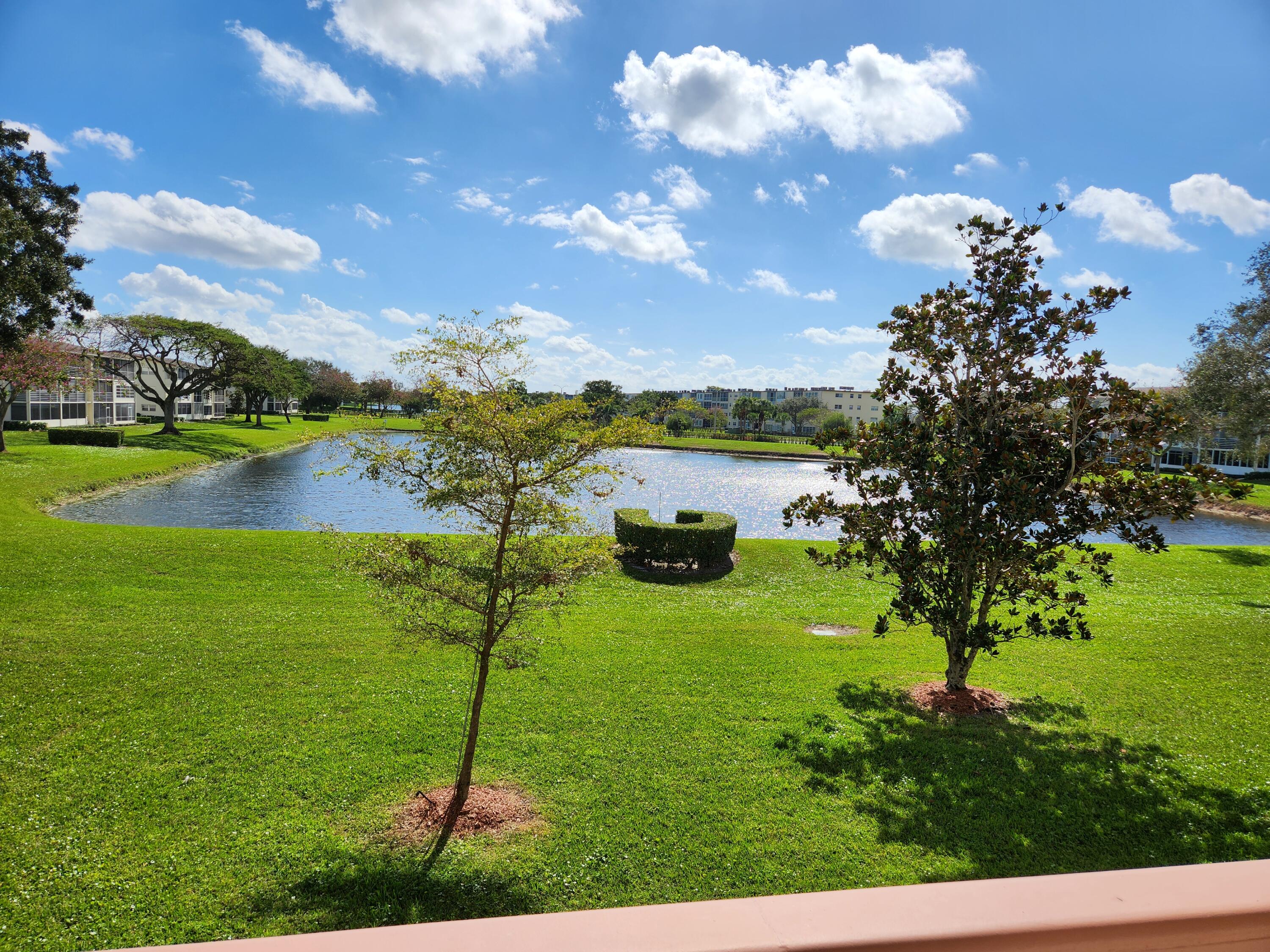 a view of a lake with houses in the back