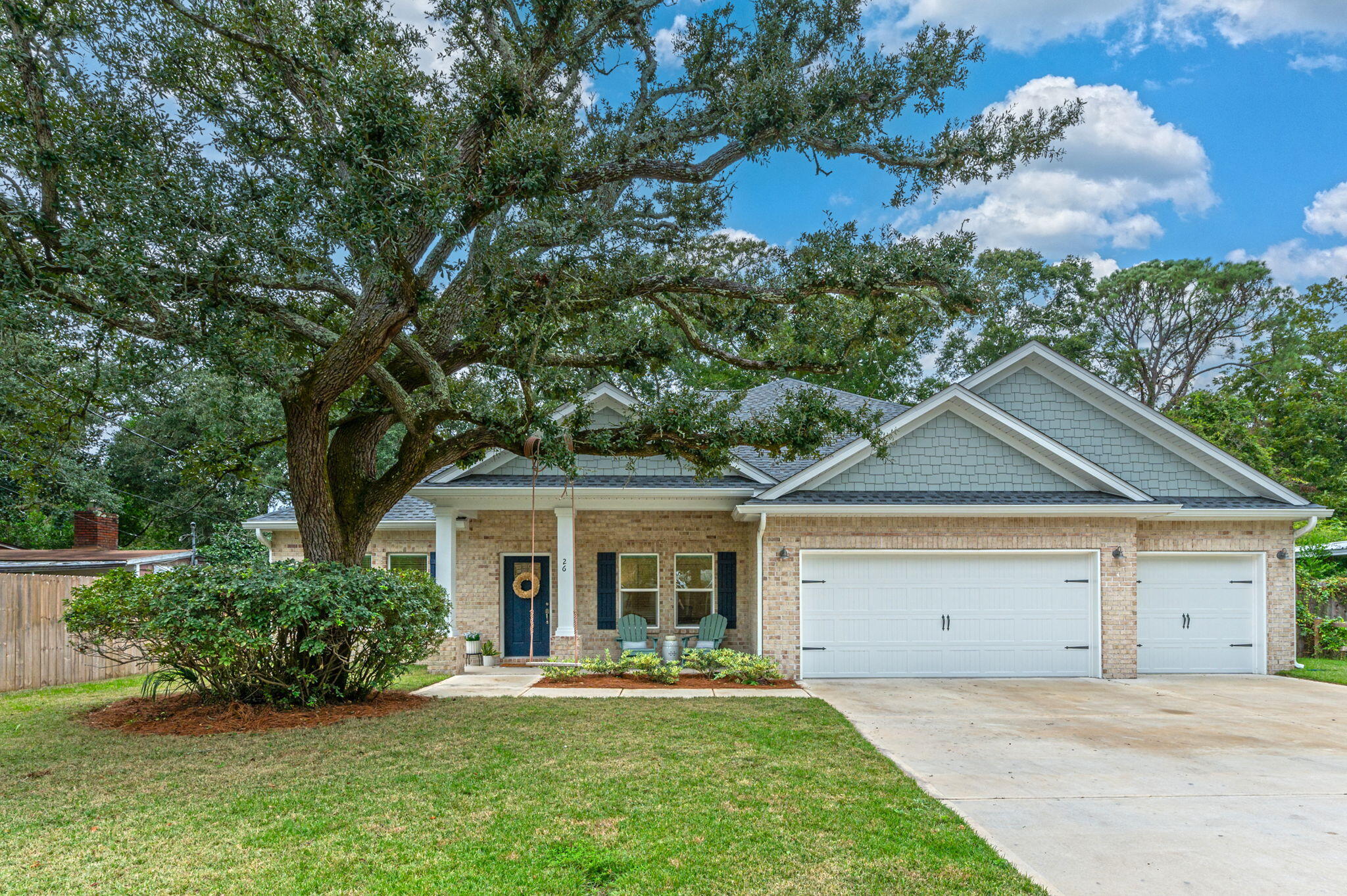 front view of a house with a yard