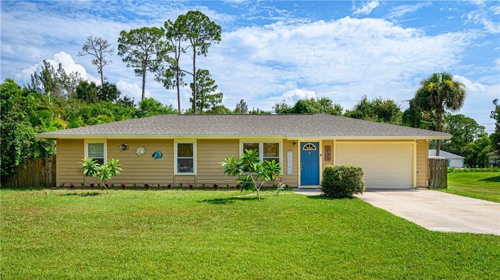 front view of a house with a yard