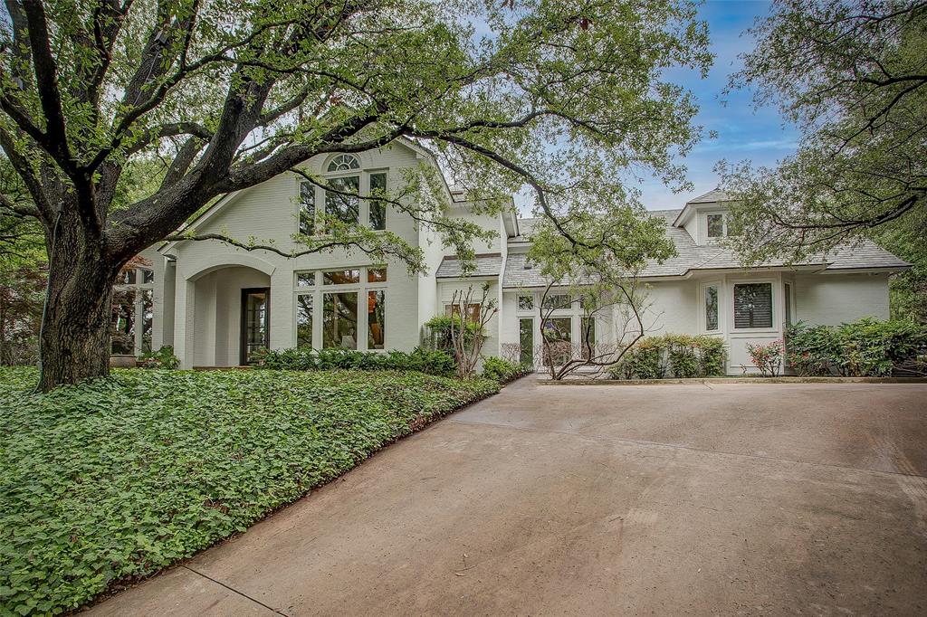 front view of a house with a garden