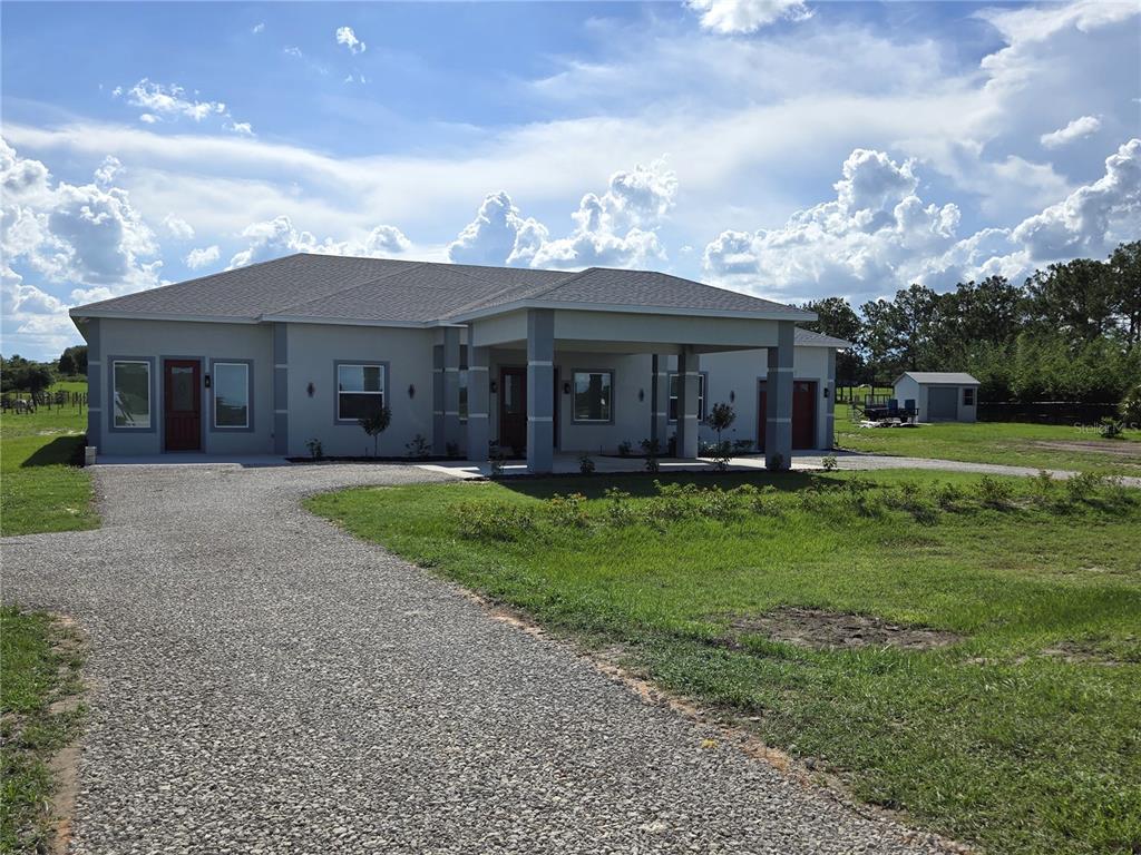 front view of a house with a yard