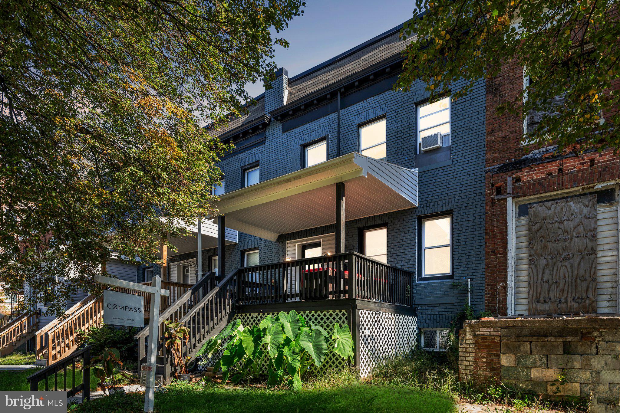 a view of house with yard outdoor seating and entertaining space