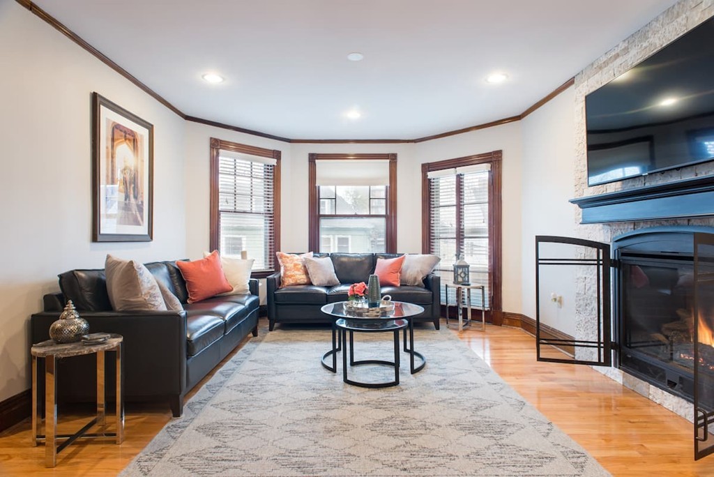 a living room with furniture and a flat screen tv